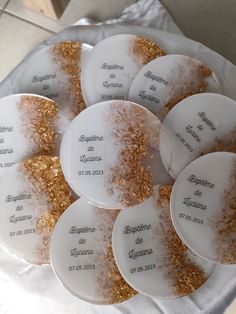 white plates with gold glitter on them sitting on a table