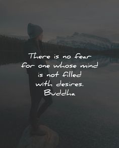 a woman standing on top of a rock next to a lake with the words there is no fear for one whose mind is not filled with desired buddha