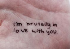 a hand with writing on it that says i'm truly in love with you