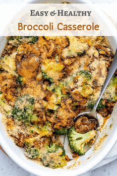 broccoli casserole in a white dish with a spoon on the side