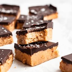 chocolate and peanut butter bars are stacked on top of each other, ready to be eaten