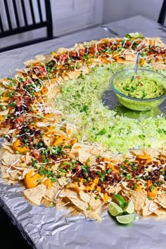 a platter filled with nachos and guacamole