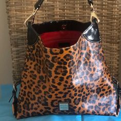 Women's Large Dooney & Bourke Purse/Tote. Lots Of Compliments When Wearing It! Animal Print With Red Lining. Dooney Bourke Handbags Tote Bags, Dooney Bourke Ostrich Handbags, Leopard Purse, Everyday Purse Dooney & Bourke, Hobo Purses Dooney & Bourke, Leather Crossbody Purse Dooney & Bourke, Dooney & Bourke Bags, Dooney Bourke, Bags Women