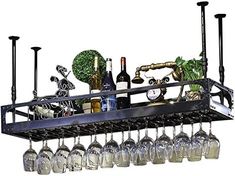 a metal rack with wine glasses and bottles hanging from it's side, filled with liquor