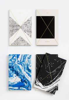 four different types of art work displayed on a white surface with black and gold lines