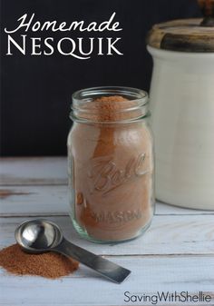 a jar filled with brown sugar next to a spoon