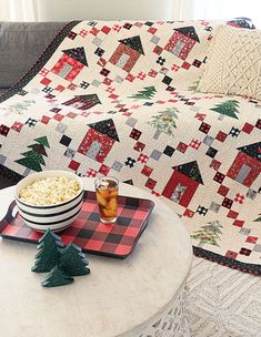 a table with a bowl of popcorn and a christmas tree on it