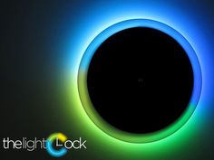 an image of a black hole in the dark with blue and green light around it