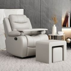 a white recliner chair and ottoman in a living room