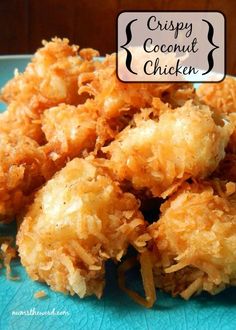 crispy coconut chicken on a blue plate with the words, crispy coconut chicken