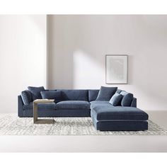 a living room with a blue sectional couch