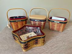 three baskets sitting on top of a table next to each other