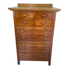 an old wooden dresser with many drawers