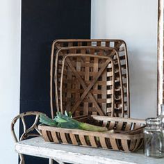 two wicker baskets sitting on top of a table