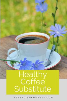 a cup of coffee sitting on top of a wooden table next to blue flowers with the words healthy coffee substitue