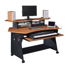 a computer desk with a keyboard and monitor