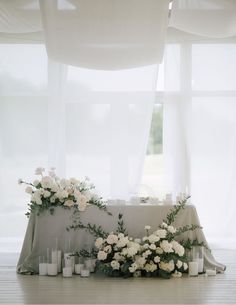 a table with candles and flowers on it