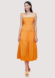 Get ready to turn heads in our Paradiso Midi Dress! Made from soft cotton poplin in a beautiful apricot shade, this dress is a true sun dress silhouette. Its relaxed fit and easy midi length make it the perfect choice for sunny days. Complete your look with sandals and a sun hat. WDWH23282 Imported Lined Self: 100% CottonLining: 100% Rayon Model is 5 ft 9.5 inches; Bust: 32", Waist: 24", Hips: 34" and wearing a size Small Runs true to size Hand wash or wash with gentle cycle with cold water with like colors, Air dry to avoid shrinkage Solid Summer Cotton Maxi Dress, Solid Cotton Summer Maxi Dress, Orange Knee-length Summer Midi Dress, Solid Midi Sundress For Brunch, Orange Cotton Dress For Day Out, Orange Summer Midi Dress, Orange Knee-length Cotton Midi Dress, Orange Midi Dress For Summer, Orange Cotton Knee-length Midi Dress