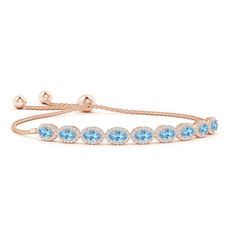 Linear oval aquamarines are secured in prong settings on this 14k rose gold bracelet. The sparkling diamond halos illuminate the charming sea-blue gemstones. This stunning bolo bracelet is adjustable to fit most wrists. 14k Rose Gold Bracelet, Bolo Bracelet, Aquamarine Bracelet, March Birthstone Jewelry, Sparkling Diamond, Aqua Marine, Yellow Gold Bracelet, Natural Aquamarine, Blue Gemstones