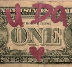 an old one dollar bill with the word utopia painted on it's face and two hearts