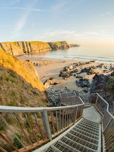 stairs lead down to the beach and ocean