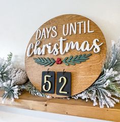 a wooden sign that says days until christmas 522