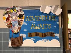 there is a sign that says adventure awaits in the library with an air balloon