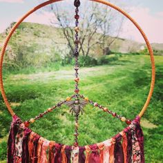 a peace sign made out of fabric and beads