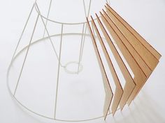 several pieces of wood sitting on top of a white table next to a wire rack