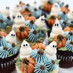 cupcakes decorated with frosting and decorations for halloween