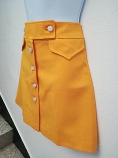 JO SKIRT Handmade skirt 100% Polyester Color: yellow You can choose your own measurements, color or length. You can choose lining, or other special request. Special request are easy, just add this listing to your cart https://www.etsy.com/listing/624364219/special-requests?ref=shop_home_active_25 If you want it on a rush you have priority shipping here, just add the one suits you the best to your cart https://www.etsy.com/shop/swingingchicksshop/items?ref=pagination&section_id=24952619 If yo Retro Yellow Skort For Spring, Yellow Pleated Flared Mini Skirt, Vintage Yellow Lined Skirt, Fitted Retro Orange Mini Skirt, Orange Fitted Retro Mini Skirt, Orange Retro Mini Skirt, Vintage Lined Mini Skirt, Fitted Yellow Mini Skirt Skort, Yellow Fitted Mini Skort