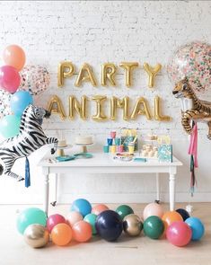 an animal themed party with balloons and streamers