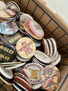 a basket filled with lots of different types of buttons