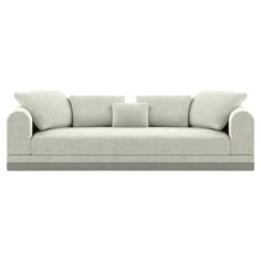 a white couch with three pillows on it's back and the seat upholstered