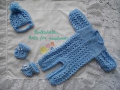 a blue knitted baby outfit and booties