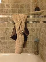 a towel hanging on the side of a bath tub