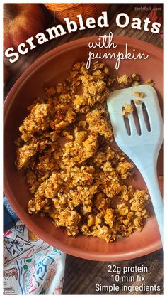 an orange bowl filled with granola oats and a fork