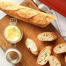 bread and butter on a wooden cutting board