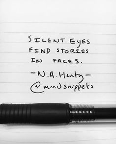 a pen sitting on top of a piece of paper next to a writing sample that says, silentt eyes find stories in faces