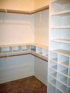 an empty room with white shelves and no one in the room or someone else is looking at it