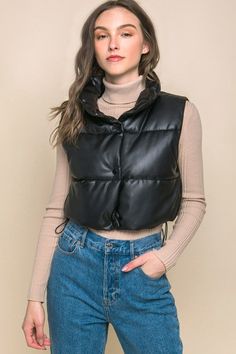 Add a touch of edgy style to your casual outfits with our Stylish Cropped Faux Leather Puffer. This trendy puffer vest is perfect for layering over your favorite tops. This is a versatile and must-have addition to your casual wardrobe, perfect for staying warm and fashionable during cooler days.Size and Fit: Model is 5' 7" wearing a size small. Fabric Contents: 100% Polyurethane Care Instructions: Machine wash cold, gentle cycle, tumble dry low. Size Measurement (inch): S: 20.0 (Bust), - (Waist) Faux Leather Puffer Vest, Leather Puffer Vest, Leather Button Up, Leather Puffer, Puff Vest, Faux Leather Vest, Black Puffer Vest, Puffy Vest, Cropped Vest