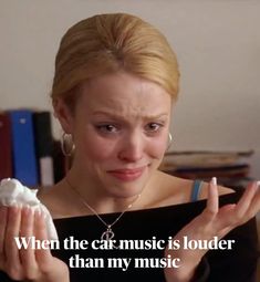 a woman holding something in her hands with the caption, when he car music is louder than my music