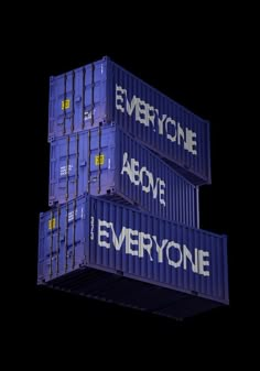 three blue shipping containers stacked on top of each other with words written on the side