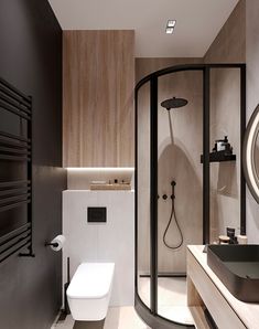 a bathroom with a toilet, sink and shower in it's center wall next to a large round mirror