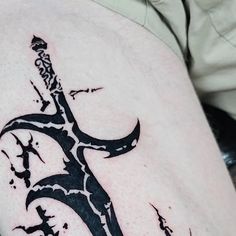 a tattoo on the leg of a man with a knife in it's hand