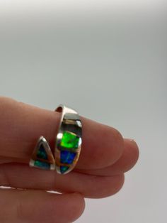 This beautiful inlay opal ring was hand made by a master craftsman, excellent quality, brilliant flashes of opal.  It is one size fits all, just squeeze or pull to tighten or release. Silver Opal Ring, Opal Ring, Opal Rings, Rings Statement, One Size Fits All, Statement Rings, Beauty Book, Hand Made, Jewelry Rings