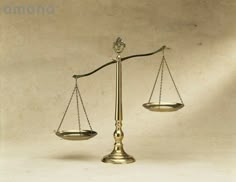 an old fashioned balance scale on a white background with the light reflecting off it's sides