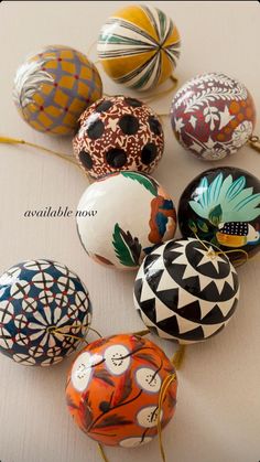 an assortment of painted eggs sitting on top of a table