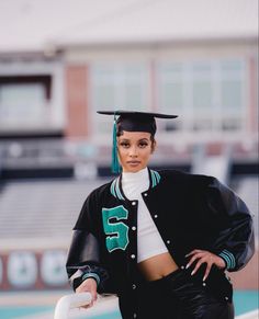 a woman in a graduation cap and gown