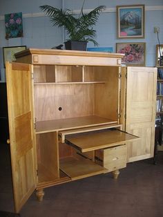 a wooden cabinet with drawers and shelves in a room